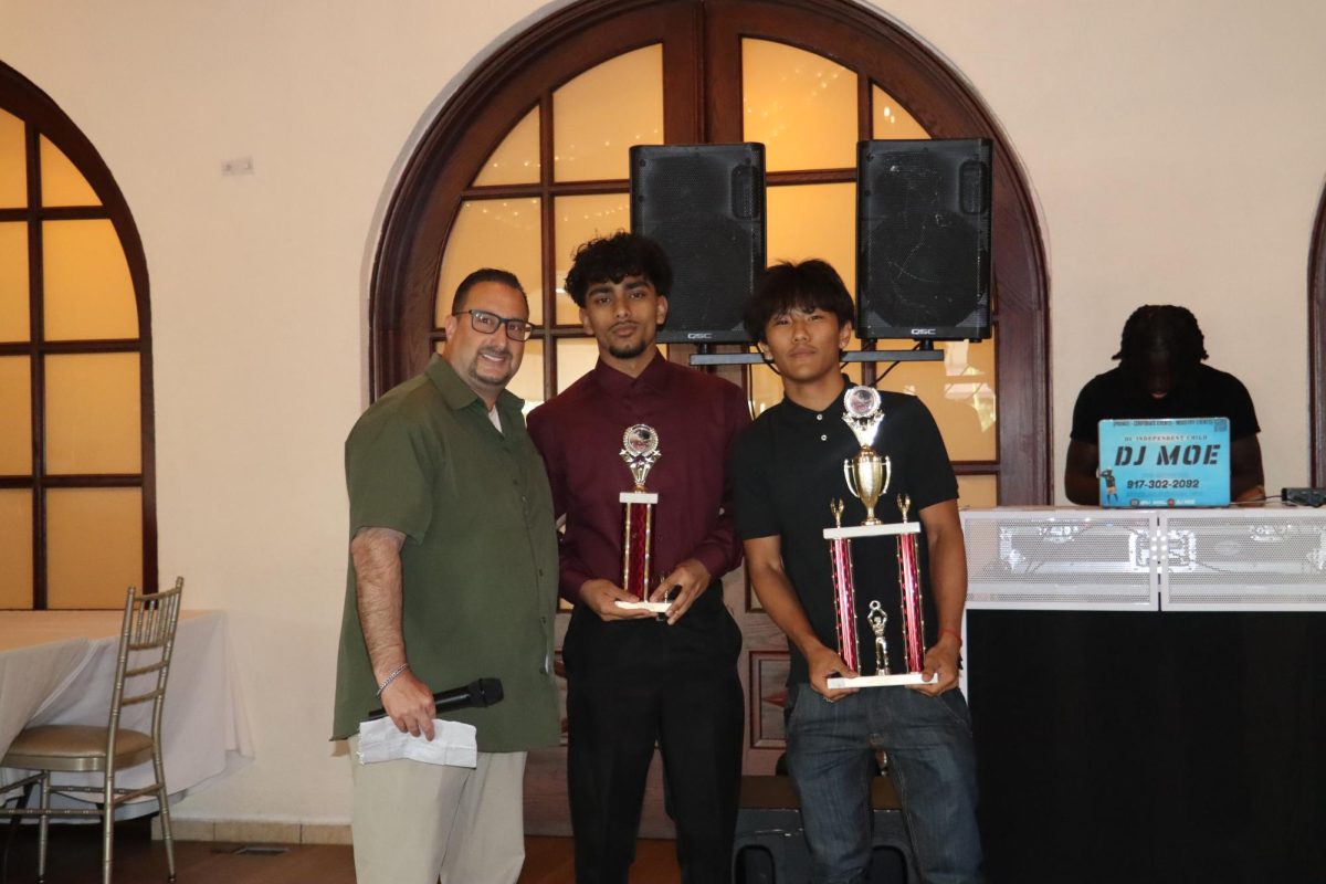 Coach Curiale with Zead Husain and Karma Dorje at the 2026 sports awards. 