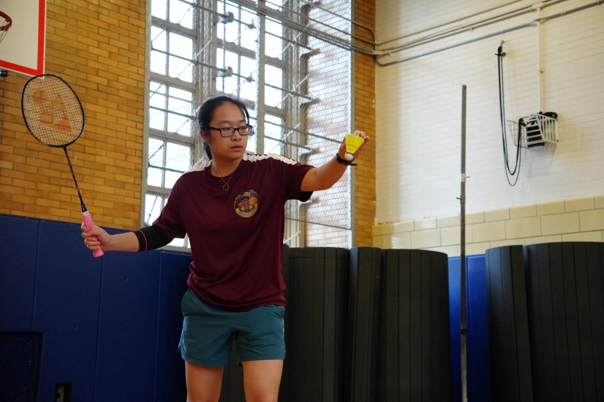 Second singles player and junior Morgan Ma preparing to serve the birdie during the quarterfinal match against Brooklyn Technical High School on May 11, winning her match 2-1.