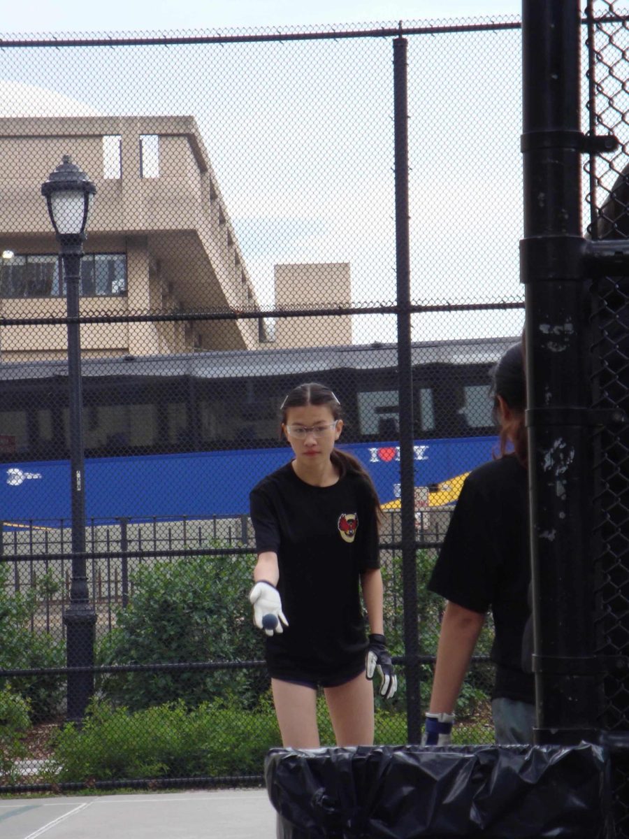 Second doubles player and sophomore Sabrina Wang preparing to serve the ball during the quarterfinal game against Stuyvesant High School on May 13.