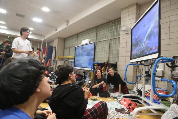 Students connect through gaming while playing Super Smash Bros at the Witching Hour overnight Reading Initiative event.