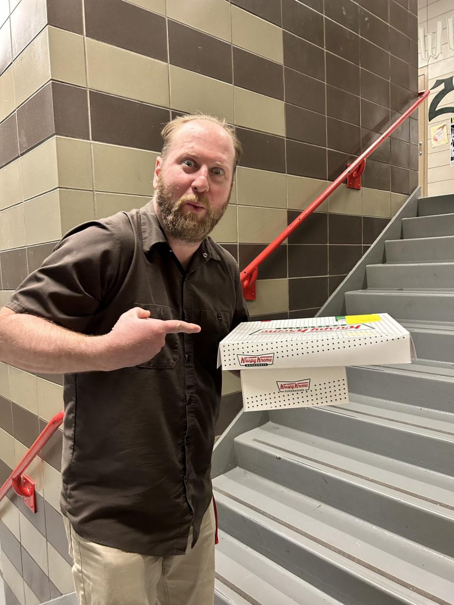 Mr. Seidel with a box of Krispy Kreme donuts