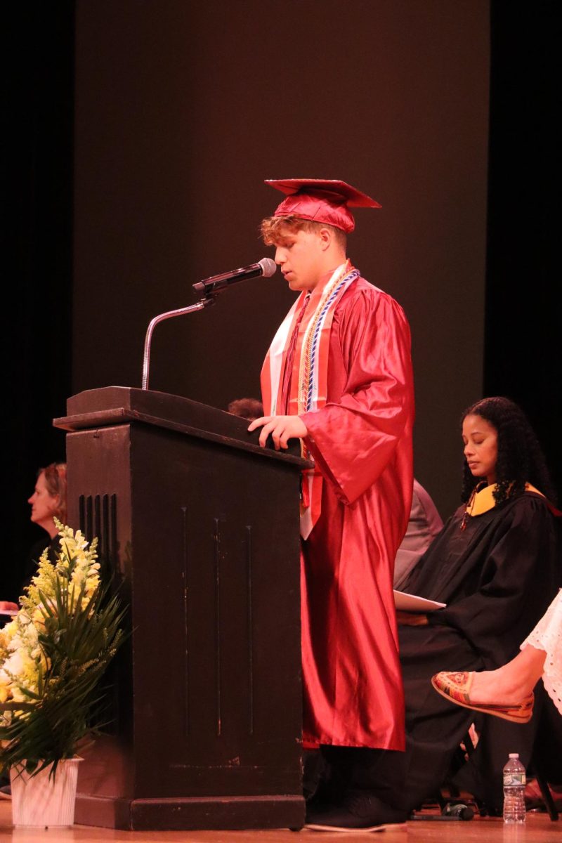 Senior Class President Mohammed Nasrallah at graduation announcing the senior gift, a bench dedicated to Mr. Seidel. 