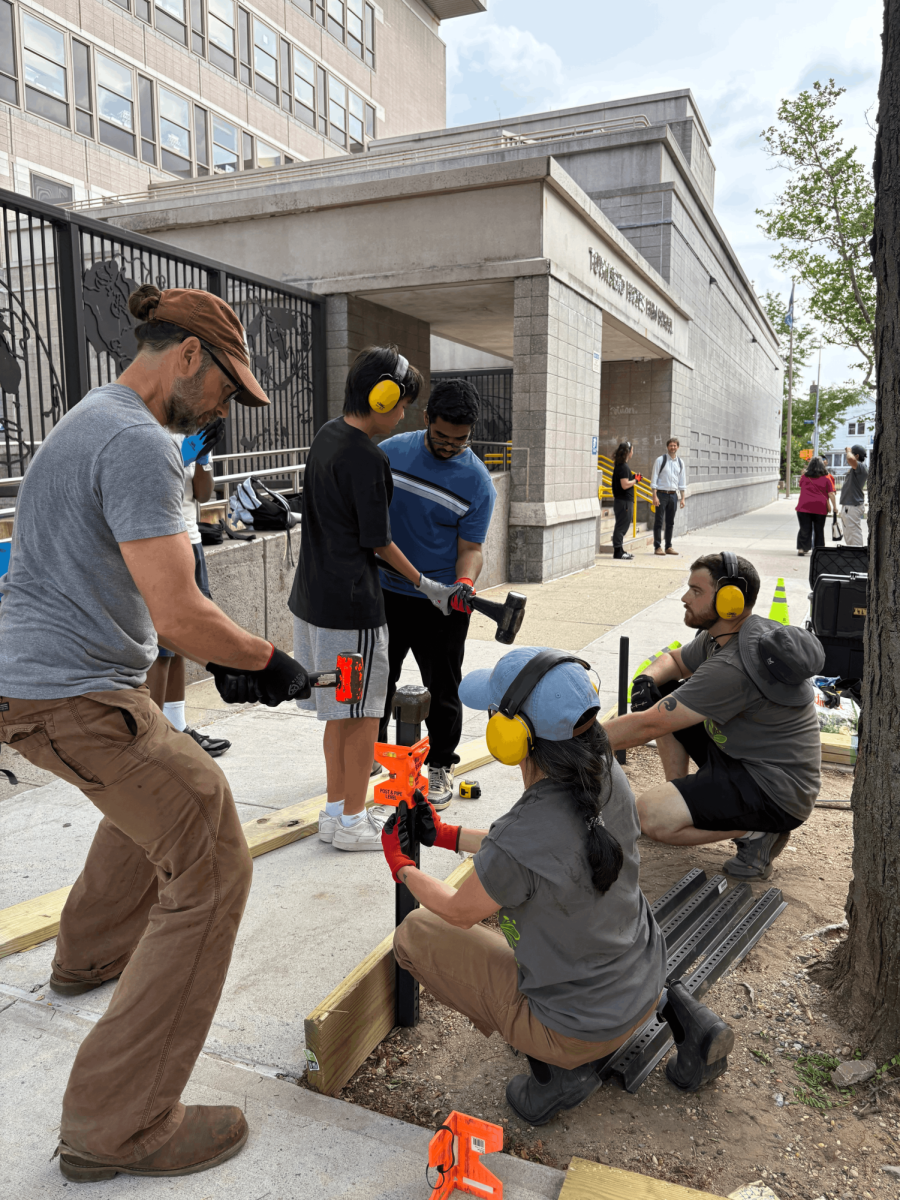 Members of the enviornmental non-profit Big Reuse working alongside students to put up the tree guards. The event was a collaboration between CLA, Green Team, and the non-profit organizations Big Reuse and TreeAGE. 