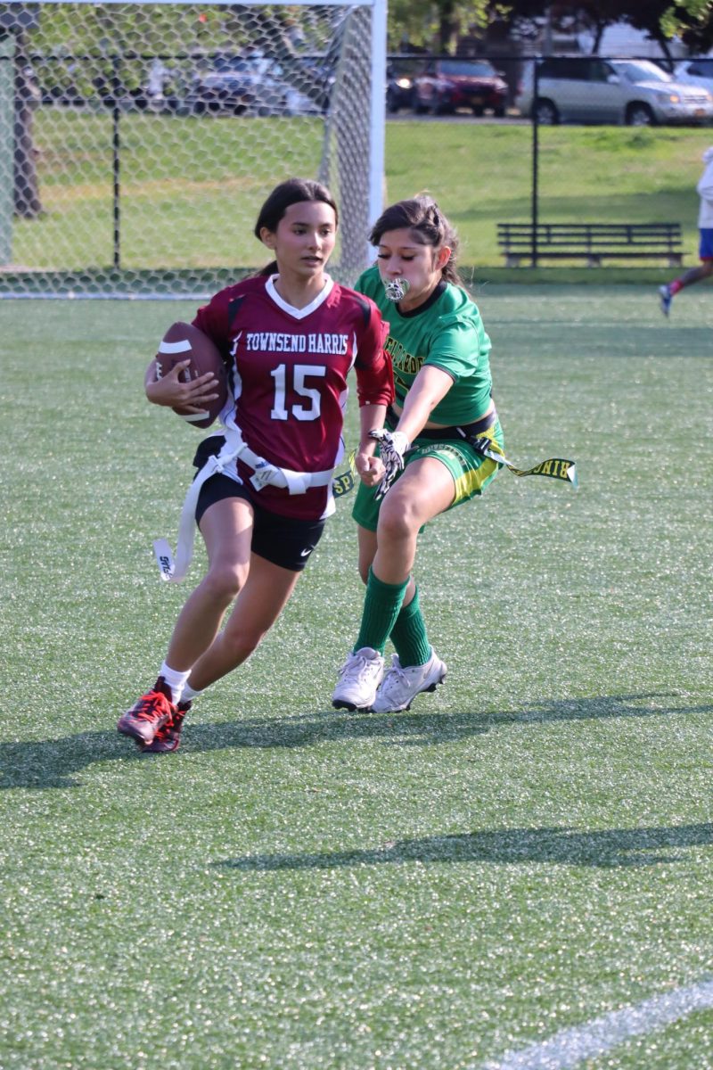 Sophomore Hayley Mitrani running with the ball while dodging a player from the opposing team during a game against Springfield Gardens on May 7.
