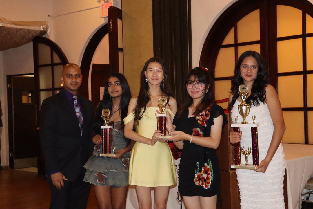 Girls varsity handball coach Joshua Raghunath alongside sophomore Siddhini Singh, sophomore Sabrina Wang, junior Kanon Banno, and junior captain Hitarthi Bhatt posing with their awards. Siddhini won Coach's Award, Sabrina and Kanon won Rising Star, and Hitarthi won MVP.