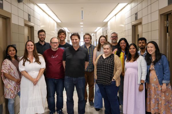 The English department posing together in the hallway.