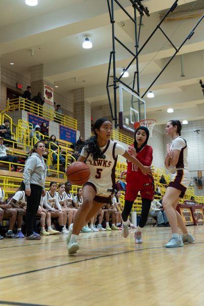 Rising senior Sophia Madrazo attempts a layup at a home game against Newtown High School on January 30.