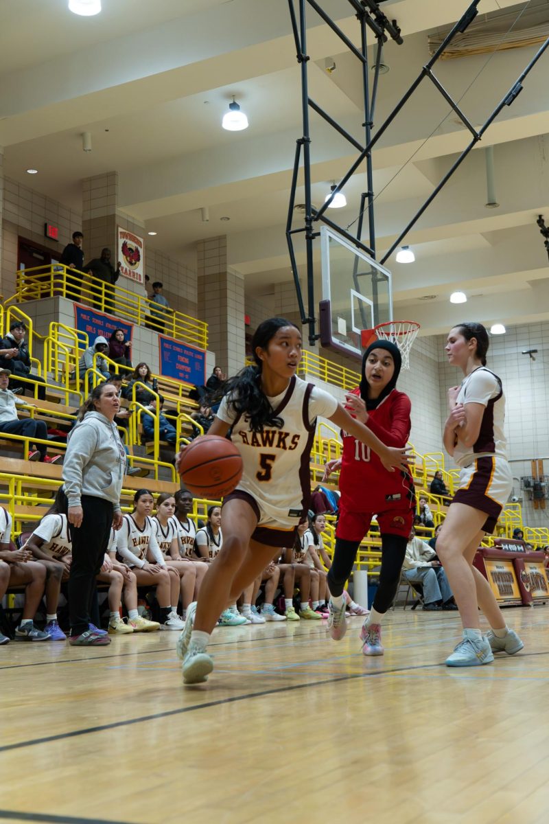 Rising senior Sophia Madrazo attempts a layup at a home game against Newtown High School on January 30.