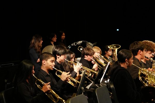 Students from the Jazz ensemble perform on stage at the May 19 night spring concert. 
