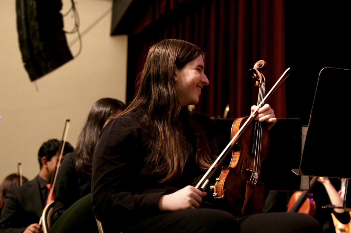 Brais performing with the THHS orchestra
